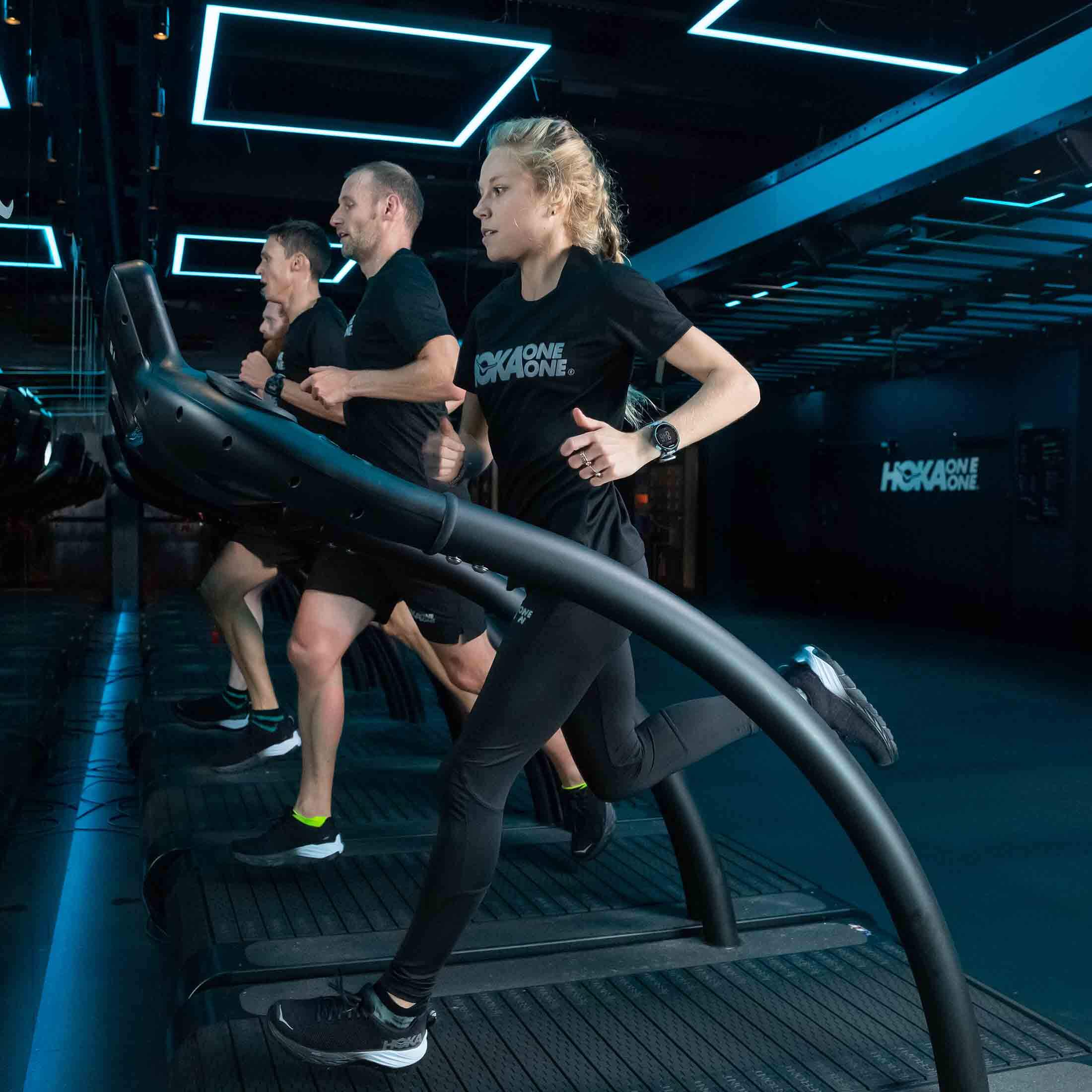 HOKA elite athlete Jenny Nesbitt runs on the treadmill at the Fly at Night event in London