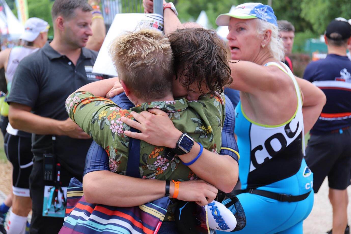 HOKA ambassador Kilian Limmer cries on the shoulder of family after qualifying for IRONMAN Kona