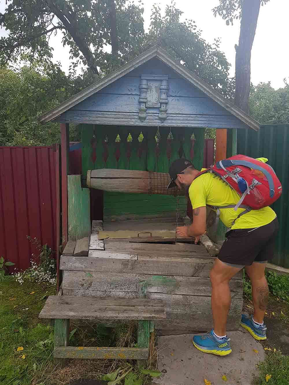 HOKA fan the Bearded Runner collects water from the well