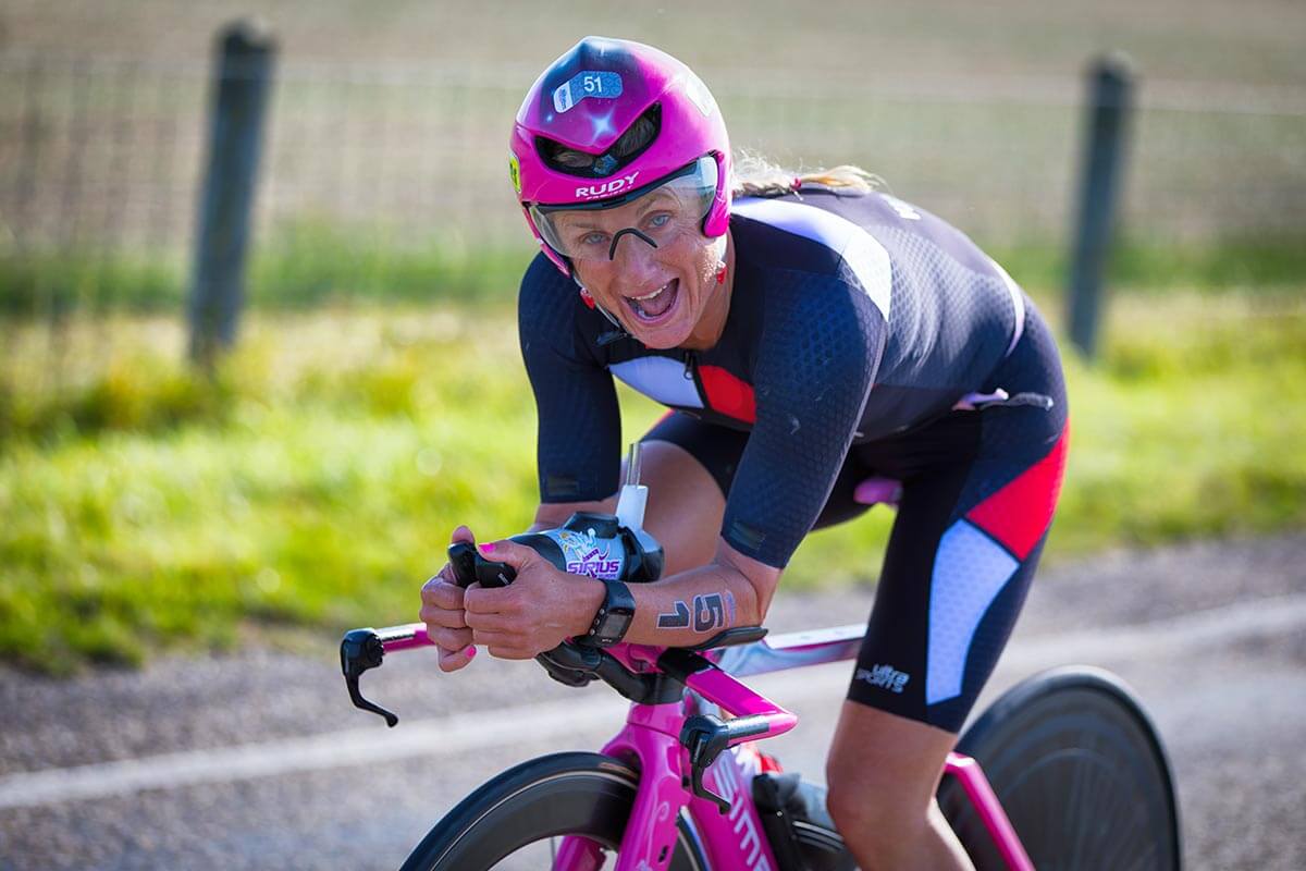 HOKA athlete Yvonne van Vlerken smiles on the bike at Challenge Almere