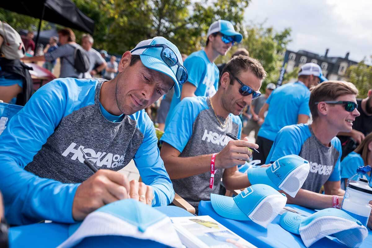 Team HOKA line up at the signing session