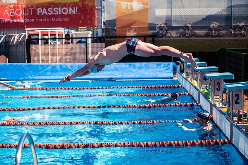 HOKA athlete Sam Proctor dives into the pool