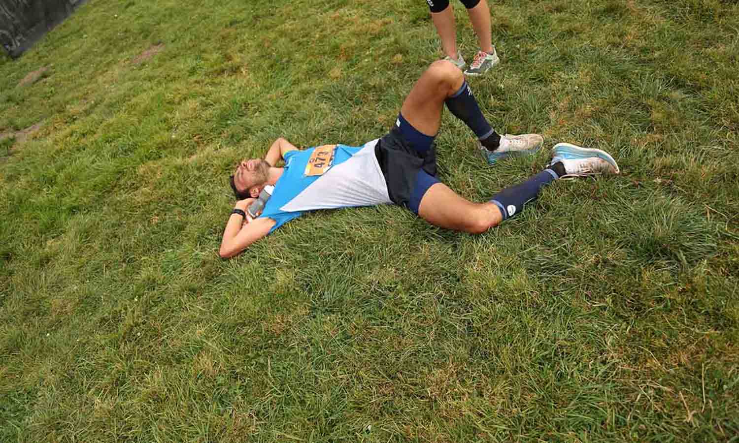 HOKA athlete Thibaut Garrivier tired on the floor