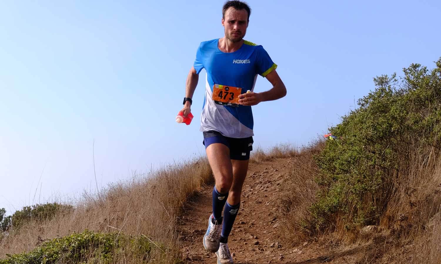 HOKA athlete Thibaut Garrivier runs down a hill