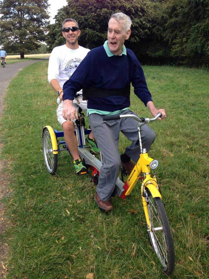 HOKA fan Tom with his father on a bicycle