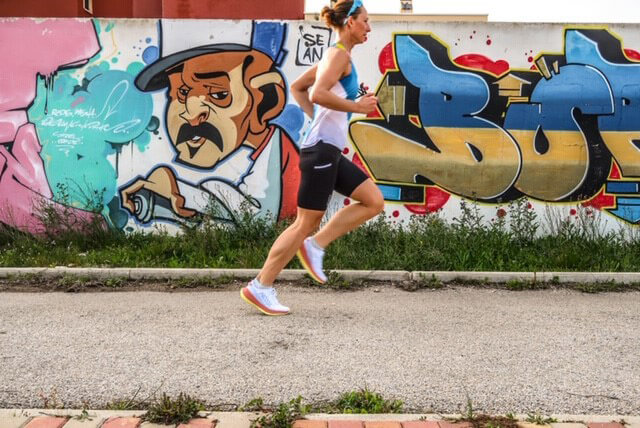 HOKA athlete Nikki Bartlett runs in the sun